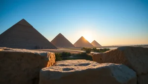 View of majestic pyramids at https://piraminds.com/ illuminated by sunrise against a clear blue sky.